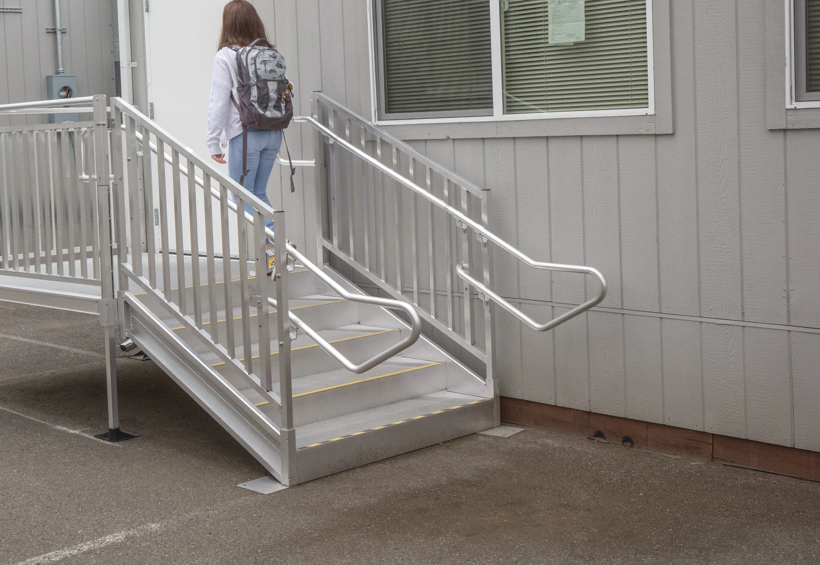 PATHWAY HD commercial aluminum steps with picket guardrails and high-traction tread at a building entrance