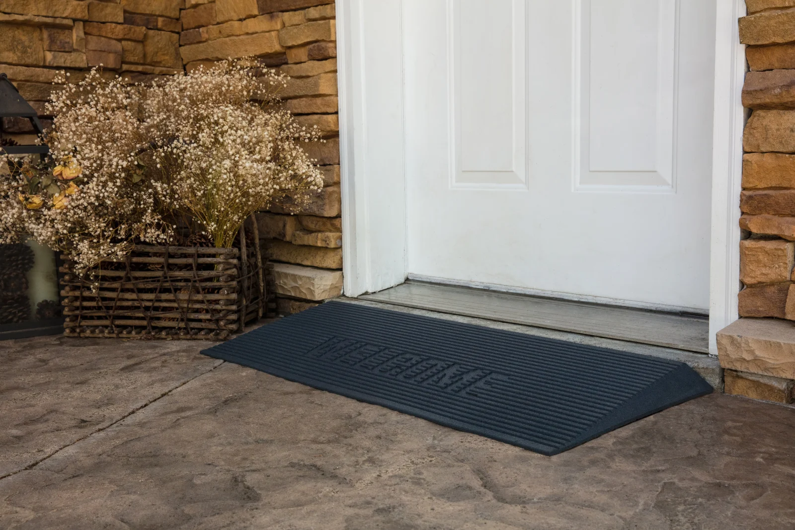 TRANSITIONS rubber threshold mat easing the step at a home's front door